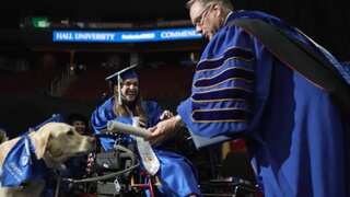 WATCH | Service dog receives honorary diploma along with owner at graduation ceremony
