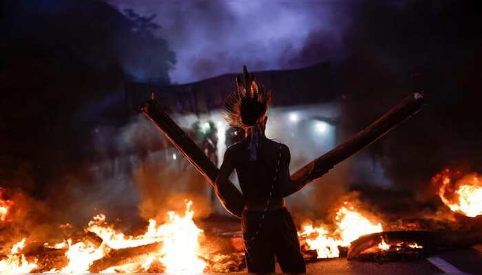 In Pics | Arrows, tear gas fly as Brazil's indigenous clash with police over land recognition
