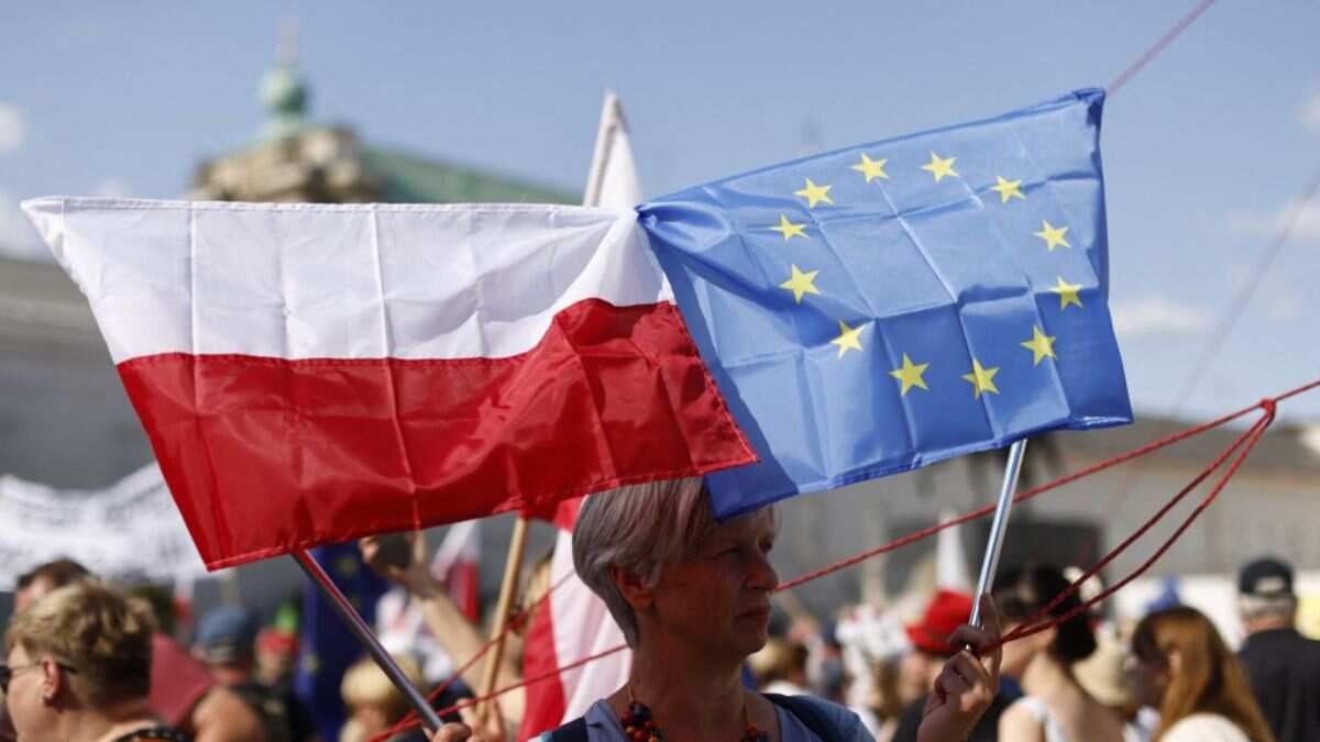 People Polish and EU flags
