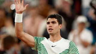 Top seed Alcaraz hunts down Tsitsipas to set up semi-final showdown with Novak Djokovic