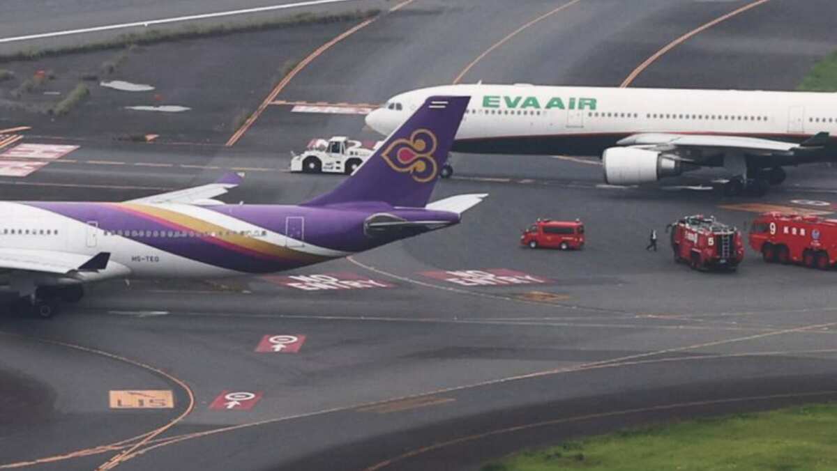 Two planes collide at Haneda airport in Japan's capital Two planes collide at Haneda airport in Japan's capital