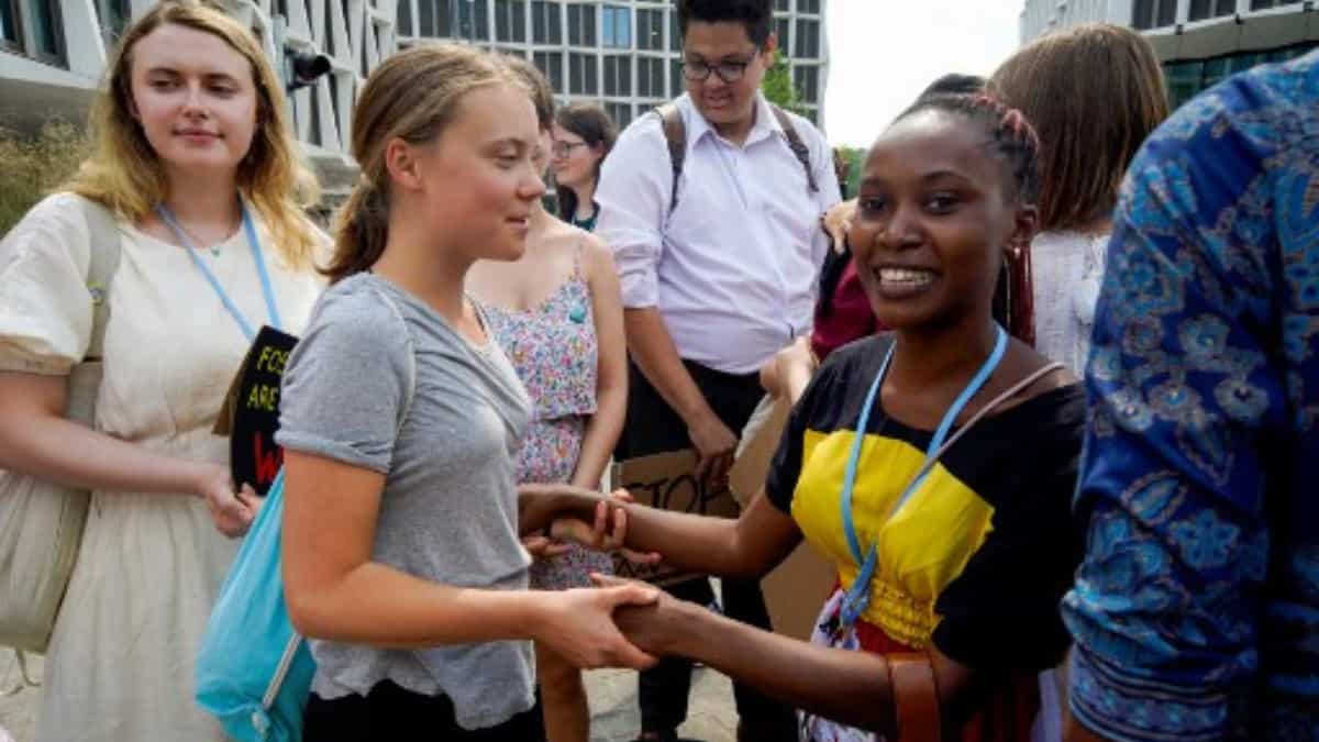 Climate activists Greta Thunberg and Patience Nabukalu