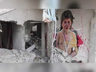 Graffiti artists in Gaza paint murals on ruined houses