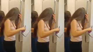 WATCH | Video of girl using hair straightener inside Delhi Metro goes viral, netizens fume