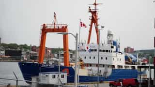 Titan submersible support ship Polar Prince returns to port, with flags at half-mast