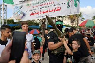 ‘Come and take selfies,’ Hamas militants put their weapons on public display for first time