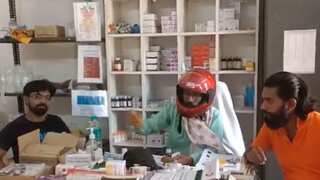 Doctor treats patients wearing helmet at Odisha hospital after piece of concrete slab falls off the ceiling