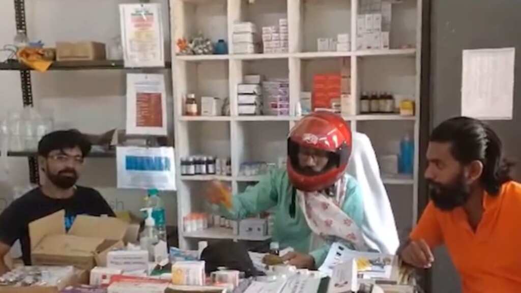Doctor treats patients wearing helmet at Odisha hospital after piece of concrete slab falls off the ceiling