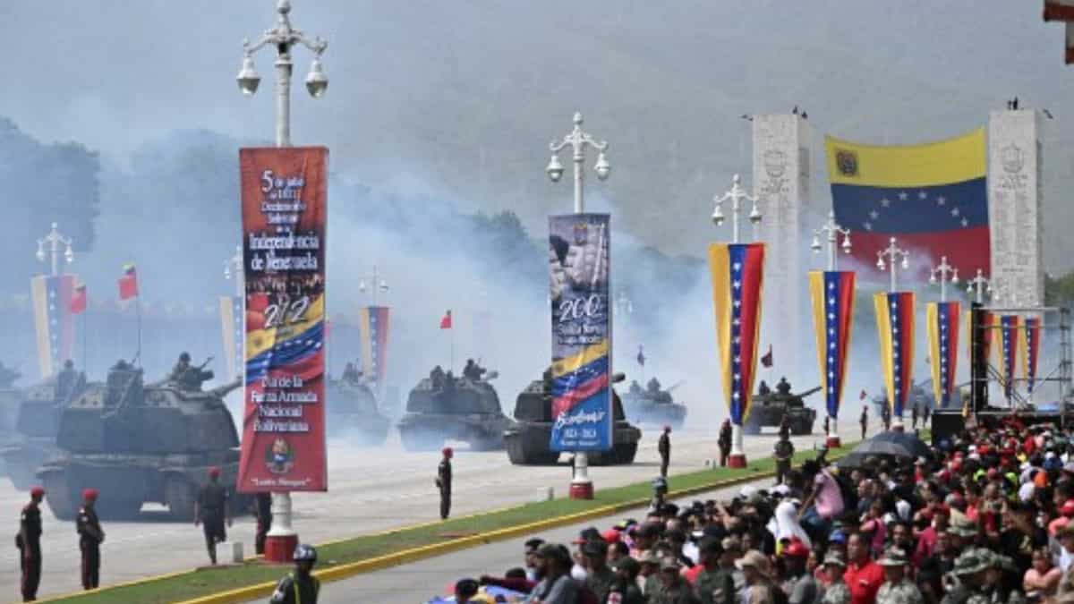 Tanks line up in formations amidst the Venezuelan flags