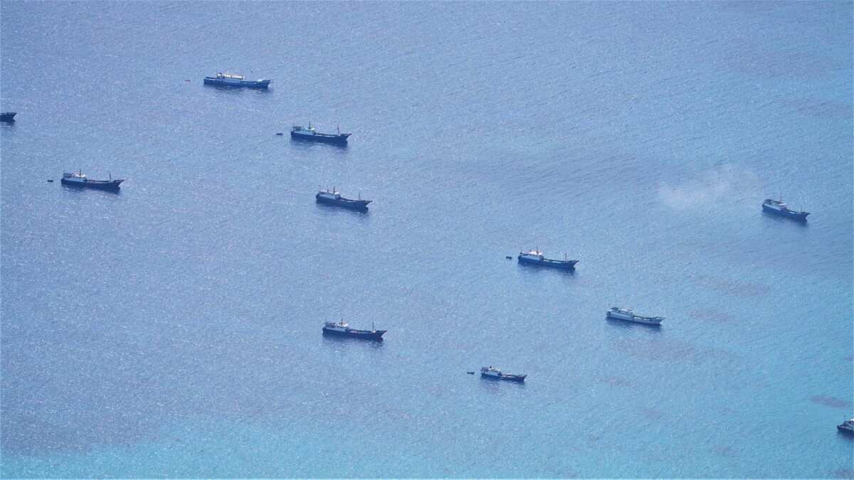 Philippines accuses China of violating its special economic zone with 'swarming' fishing vessels Philippines accuses China of violating its special economic zone with 'swarming' fishing vessels
