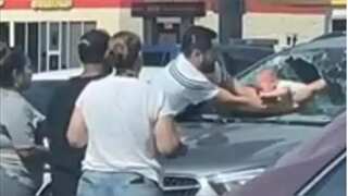 WATCH | Father breaks windshield to save baby from hot car in Texas