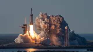 SpaceX postpones launch of world's largest private communications satellite