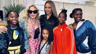 Madonna and Beyonce pose backstage with their daughters during the Renaissance concert
