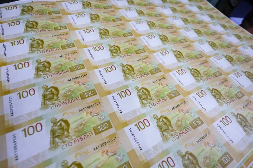 Russian ruble drops to 100 against dollar for first time since March 2022
