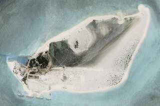 Satellite images reveal China building airbase on disputed South China Sea island
