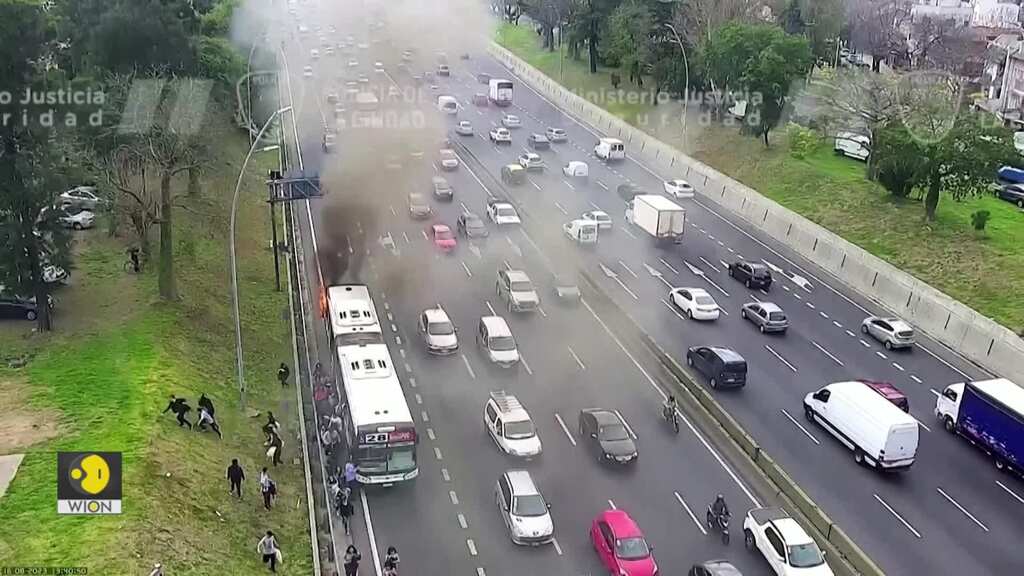 Watch moment passengers flee after bus catches fire