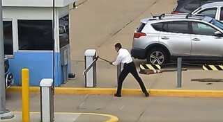 Watch: Pilot attacks parking gate with axe 20 times at Denver Airport after ‘hitting breaking point’