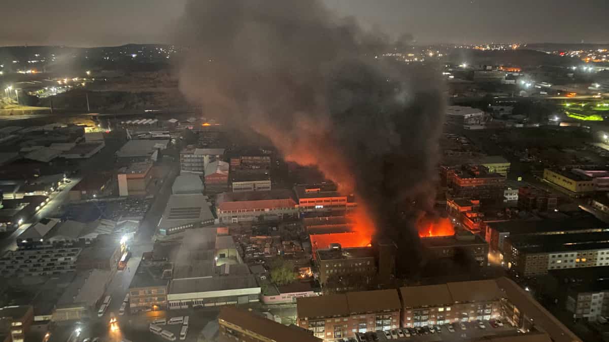 Johannesburg fire: Firefighters and sniffer dogs search for victims, clues in ashes