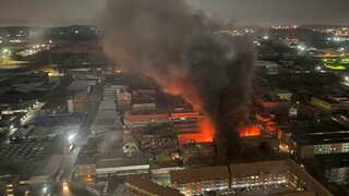 Johannesburg fire: Firefighters and sniffer dogs search for victims, clues in ashes