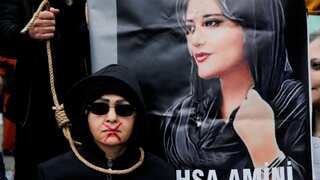 Iranian security forces briefly detain Mahsa Amini's father on her first death anniversary