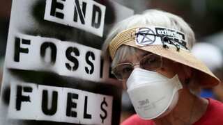 Ahead of UNGA, thousands march against fossil fuels in NYC, cheered on by AOC from Biden's party