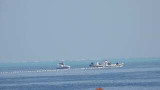 Philippines accuses China of installing 'floating barrier' in South China Sea