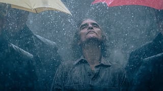Joker 2 image: Joaquin Phoenix's Arthur Fleck stands alone in rain
