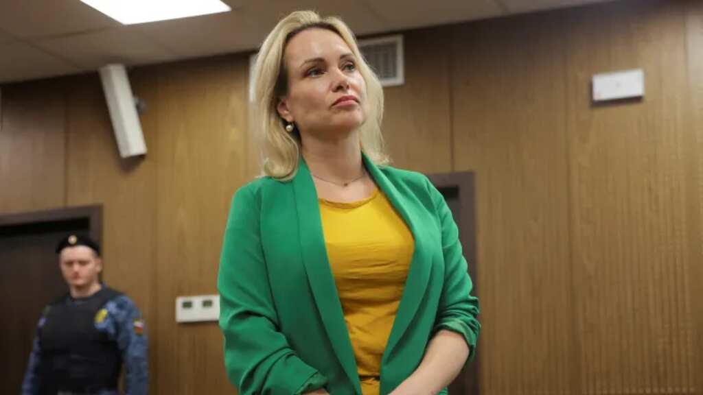 Russian journalist who flashed anti-war placard on air sentenced to over 8 years in jail