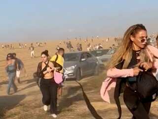 Video shows music festival attendees fleeing site amid attack by Hamas militants