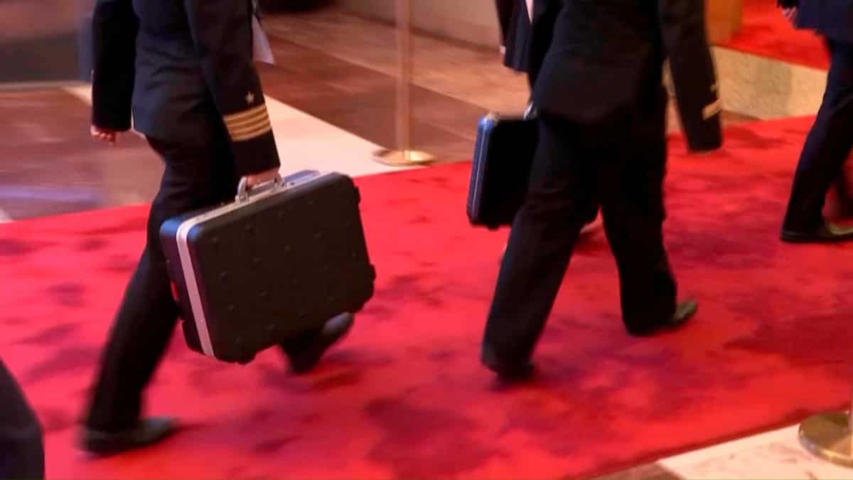 Putin filmed with 'nuclear briefcase' being carried by Russian officers