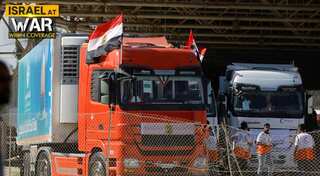 Trucks, filled with humanitarian aid, enter Gaza through Rafah crossing