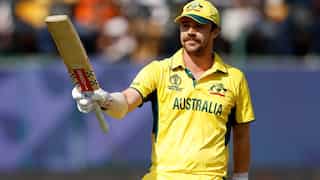 Travis Head's maiden World Cup hundred sees Australia through in tight trans-Tasman clash in Dharamsala