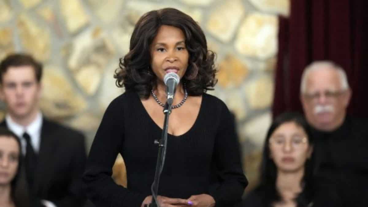 US singer Joanna Maddox performs during funeral service