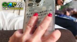 Italy PM Meloni sports 'anxiety' phone cover during COP28