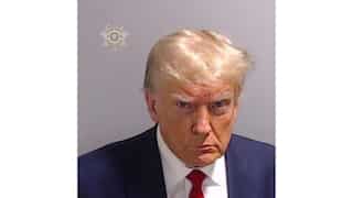 Trump NFT cards worth $99 each will get you scraps of suit he wore for his mug shot. Interested?