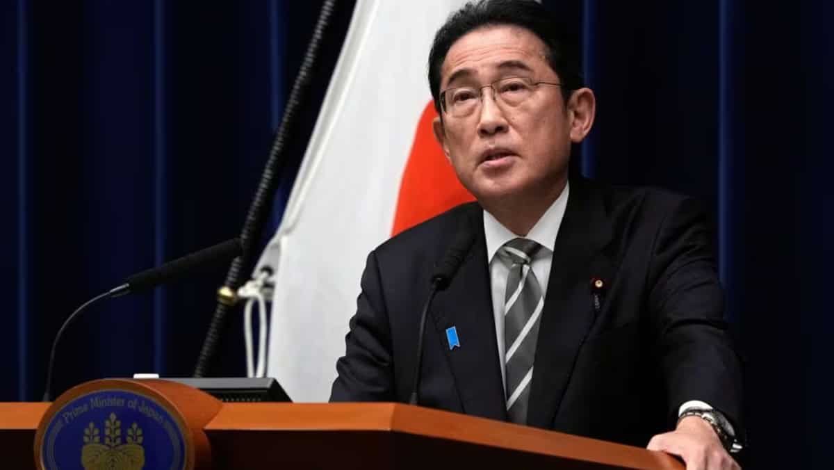 Japan PM overhauls cabinet in bid to weather financial scandal
