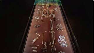 89-yr-old mystery is solved. An infant was buried with his 4th-great-grandmother 9,000 years ago