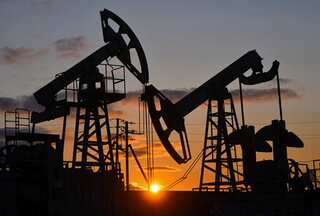 Oil prices volatile amid mixed crude inventory data