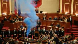 Smoke bombs thrown in Albanian parliament after former president Sali Berisha stripped of immunity