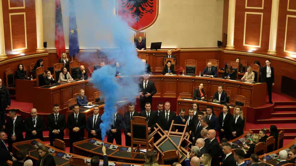 Smoke bombs thrown in Albanian parliament after former president Sali Berisha stripped of immunity