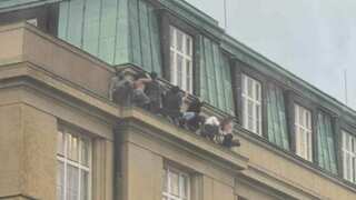 Prague university shootout: Video shows people hiding on building ledge to escape gunman