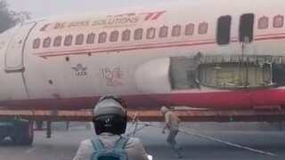 India: Airplane transported by truck gets trapped under bridge in Motihari, Bihar