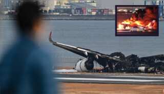 Investigations start as charred Japan Airlines parts lie on tarmac