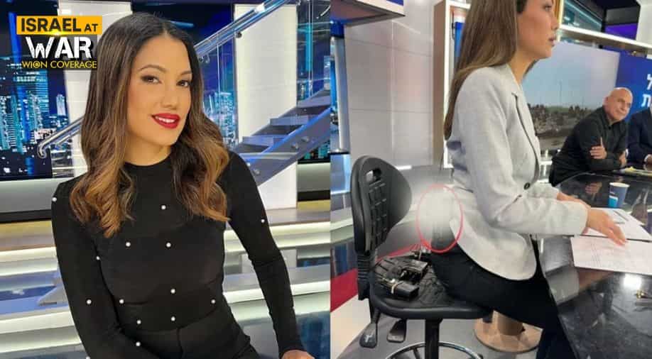 Israel-Hamas war: News anchor shocks internet by carrying gun on live broadcast