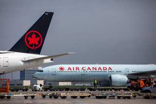 Passenger falls off Air Canada plane after opening cabin door, apprehended