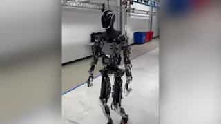 Elon Musk 'walks with' Tesla’s Optimus robot, excitement erupts online. WATCH