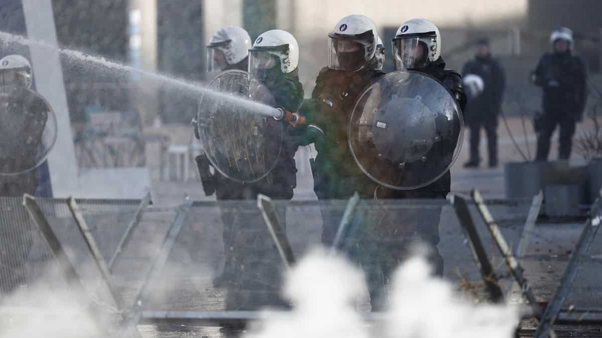 Police fire tear gas and spray water