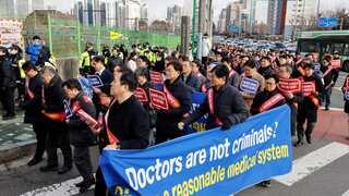 Striking South Korean doctors face threat of licence cancellation amid prospects of talks