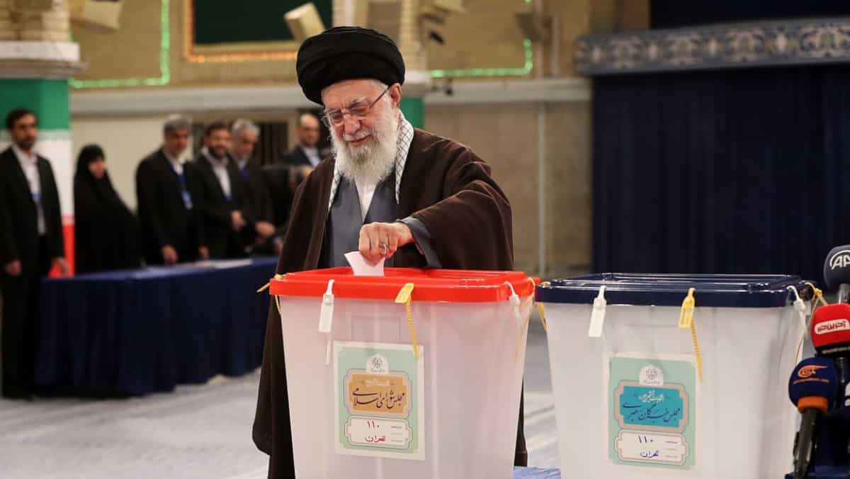 Iranians vote to finalise makeup of conservative-dominated chamber
