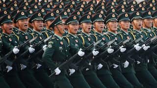 China to raise defence spending as Beijing adopts tougher language against Taiwan on reunification